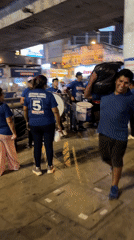 Street drummers gather with balloons in San Juan de Miraflores