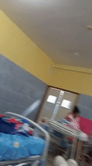Hospital room with patient documented by unknown witness