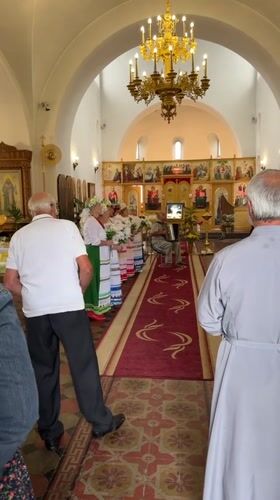 Rainy village Sunday: church music, ducks, and chickens in Nikulskoye