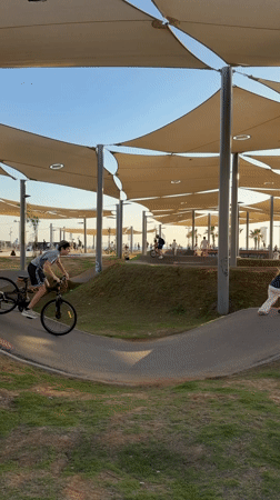 Cyclists and scooter riders use Tel Aviv pump track