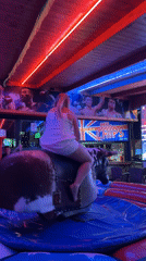 Nighttime entertainment events with mechanical bull and platform performance