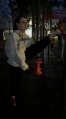 Woman exercises at outdoor fitness area in Kragujevac