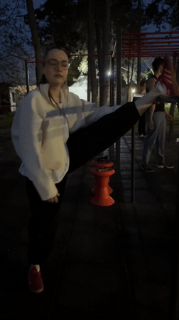 Woman exercises at outdoor fitness area in Kragujevac