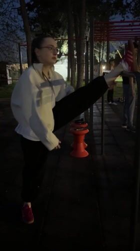 Woman exercises at outdoor fitness area in Kragujevac
