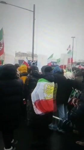 Crowd carries Iranian flags with lion emblem in Eqlid