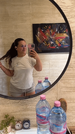 Mirror selfie moment in Plovdiv, pink phone in hand
