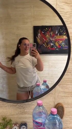 Mirror selfie moment in Plovdiv, pink phone in hand