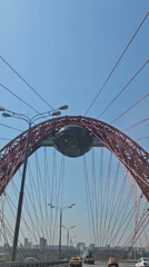 Driver crosses distinctive red cable-stayed bridge in Khimki