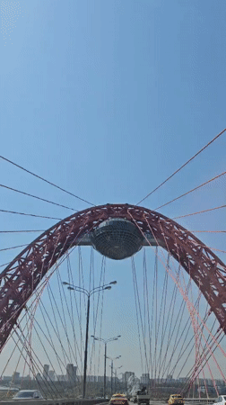 Driver crosses distinctive red cable-stayed bridge in Khimki