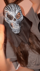Costume play with skull masks captured indoors in Budva