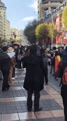 Large crowd walks through downtown La Paz streets