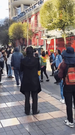 Large crowd walks through downtown La Paz streets