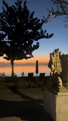 Sunrise over Sanur Beach with Mount Agung on the horizon