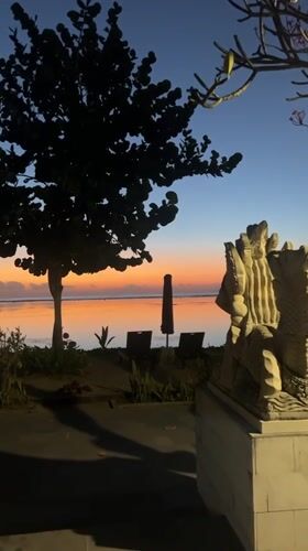 Sunrise over Sanur Beach with Mount Agung on the horizon