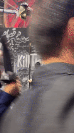 Tehran chalk wall fills with handwritten messages