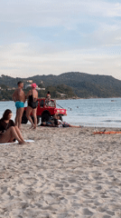 Beachgoers enjoy sunny day at Karon beach, Thailand