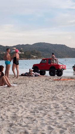 Beachgoers enjoy sunny day at Karon beach, Thailand