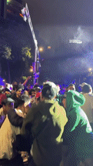 Nighttime concert draws Mexican flag-waving crowd in festive street gathering