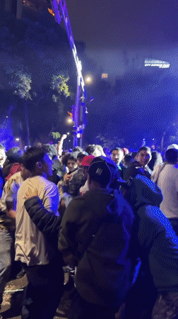 Nighttime concert draws Mexican flag-waving crowd in festive street gathering