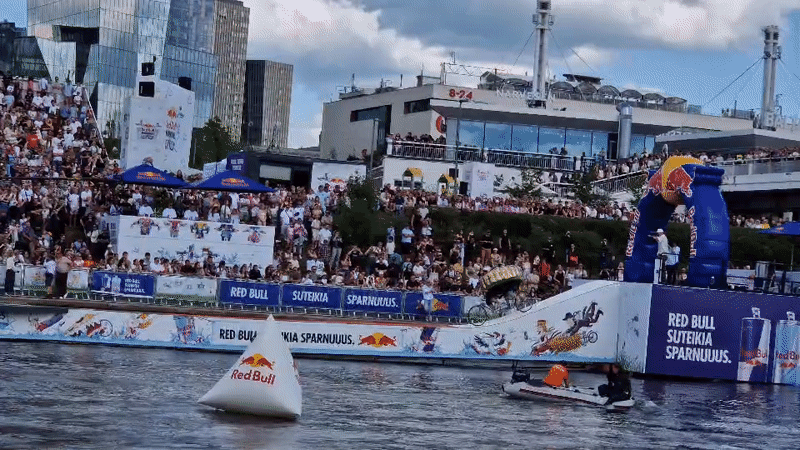 Vilnius city scenes: waterside event, downtown streets, park statue