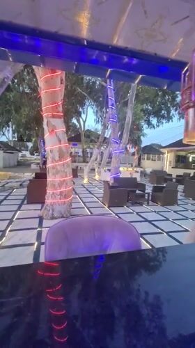 Evening leisure venue captured with pool decorations and lounge