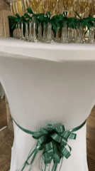 Champagne flutes with green ribbons set for a celebration in Sredets