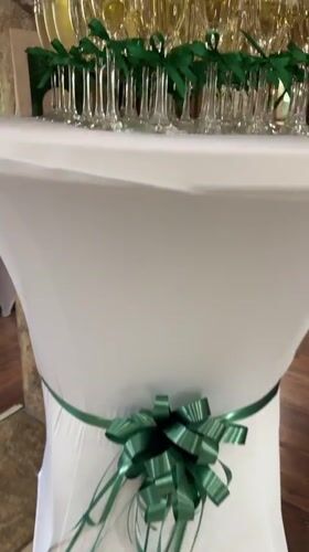 Champagne flutes with green ribbons set for a celebration in Sredets