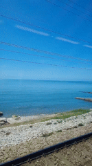 Train passenger films coastal railway journey near Sochi