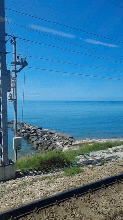 Train passenger films coastal railway journey near Sochi