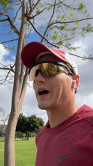 Man records video message on grassy field in Ramat Gan