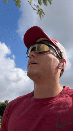 Man records video message on grassy field in Ramat Gan