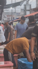 Evening market activity captured in Lhokseumawe, Indonesia