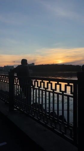 Summer solstice sunset along the Ternopil Lake promenade