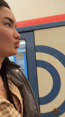 Woman poses expressively at Moscow Metro station