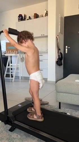 Toddler walks on home treadmill in Kiryat Bialik