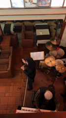 Live music performance captured at dimly lit venue