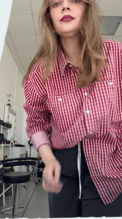 Woman in striped shirt observed at salon in Izhevsk