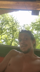 Shirtless man with dreadlocks recorded in Resen, Bulgaria