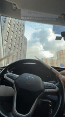 Driver plays drumsticks on steering wheel in Moscow Volkswagen