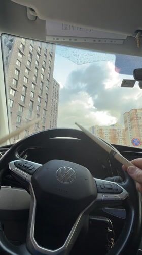 Driver plays drumsticks on steering wheel in Moscow Volkswagen