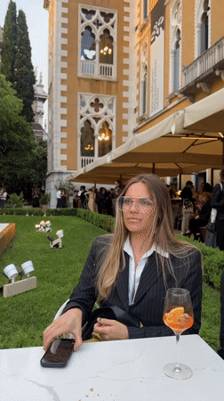 Women enjoy drinks near Chihuly Venice 2026 art exhibition