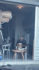 Man crafting woven object in Kutuh building