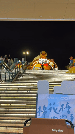 Evening scenes captured around cartoon duck installation in Tianhe District