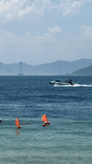 Nha Trang beach in full holiday swing — jet skis, parasails, inflatables