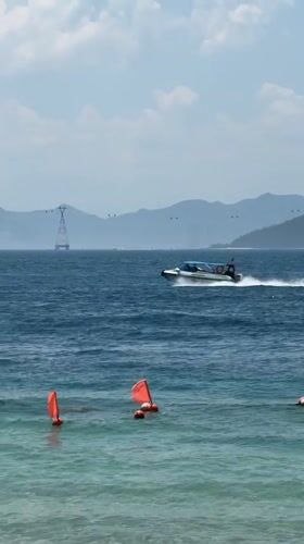 Nha Trang beach in full holiday swing — jet skis, parasails, inflatables