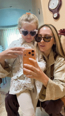 Woman and child take mirror selfie in Kamyshin