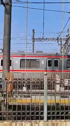 Morning commuter trains operate through Depok, Indonesia stations