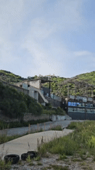 Building complex documented on Montenegro hillside amid cloudy skies
