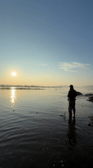 Dawn fishing session by waterfall in Chernushka, Russia