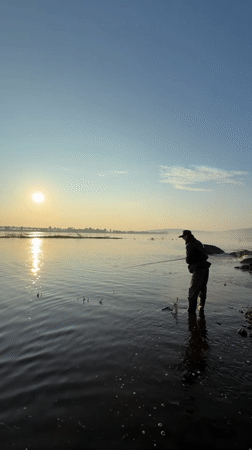 Dawn fishing session by waterfall in Chernushka, Russia